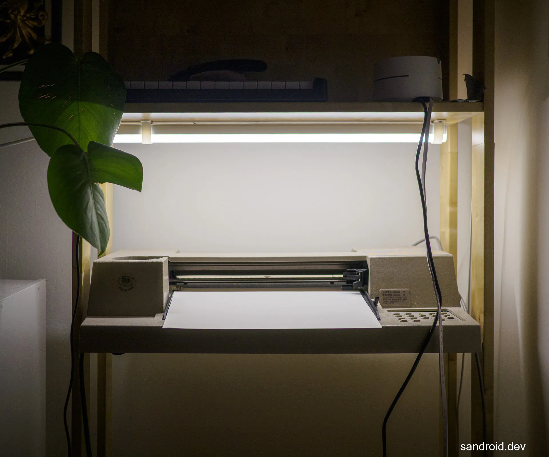 Light fixture mounted above the plotter